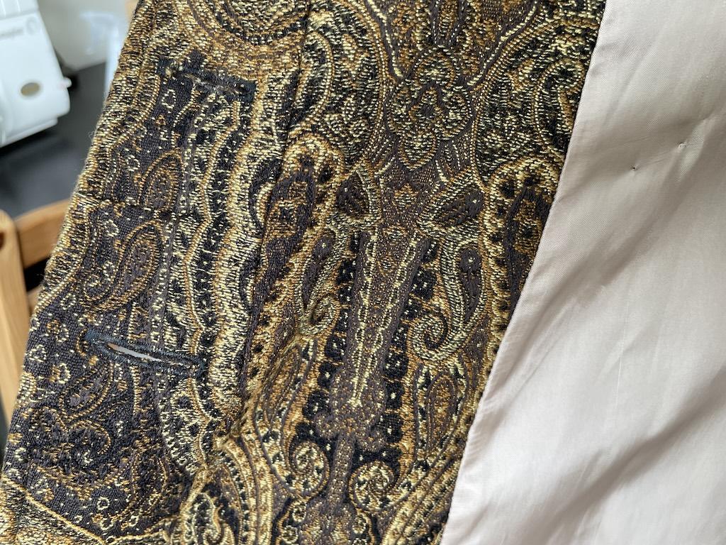 Close up view of Luna’s diy dress coat inside front panel with button hole and lining