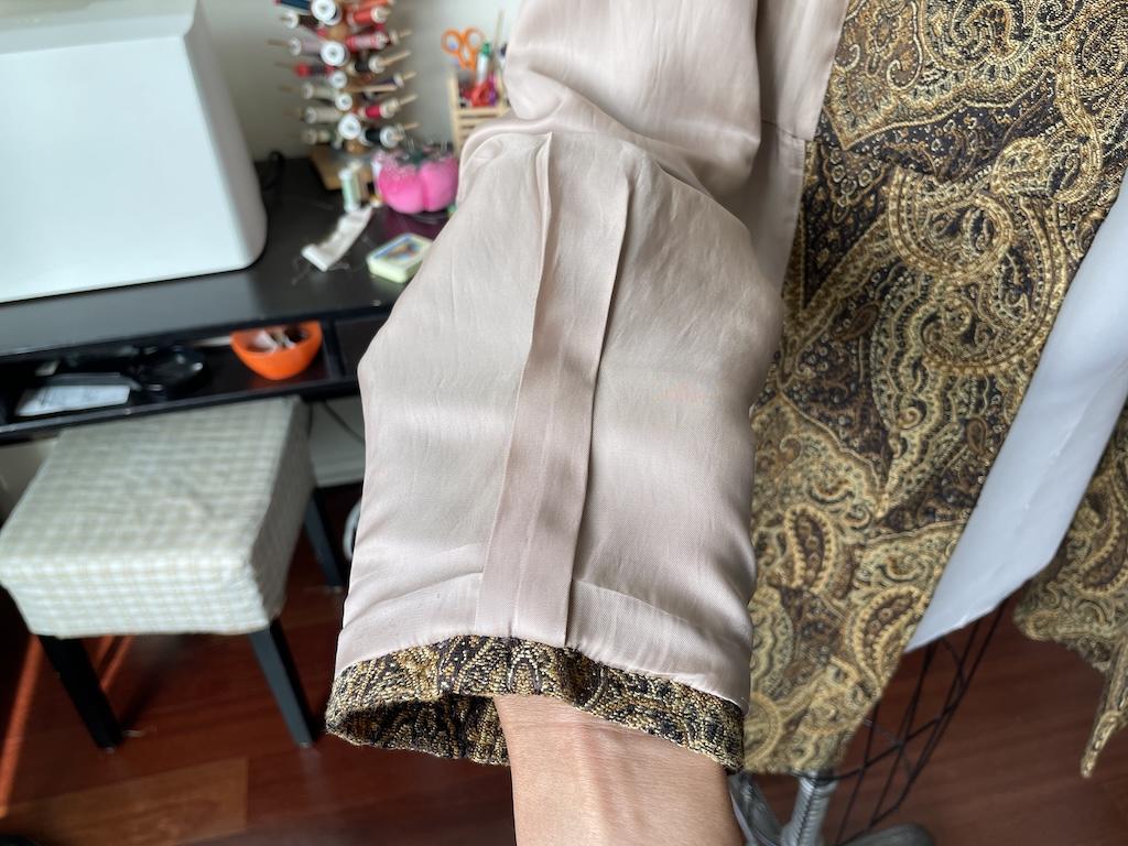 Close up of sleeve lining of Luna’s coat on the dress form, made from Simplicity S2311 sewing pattern