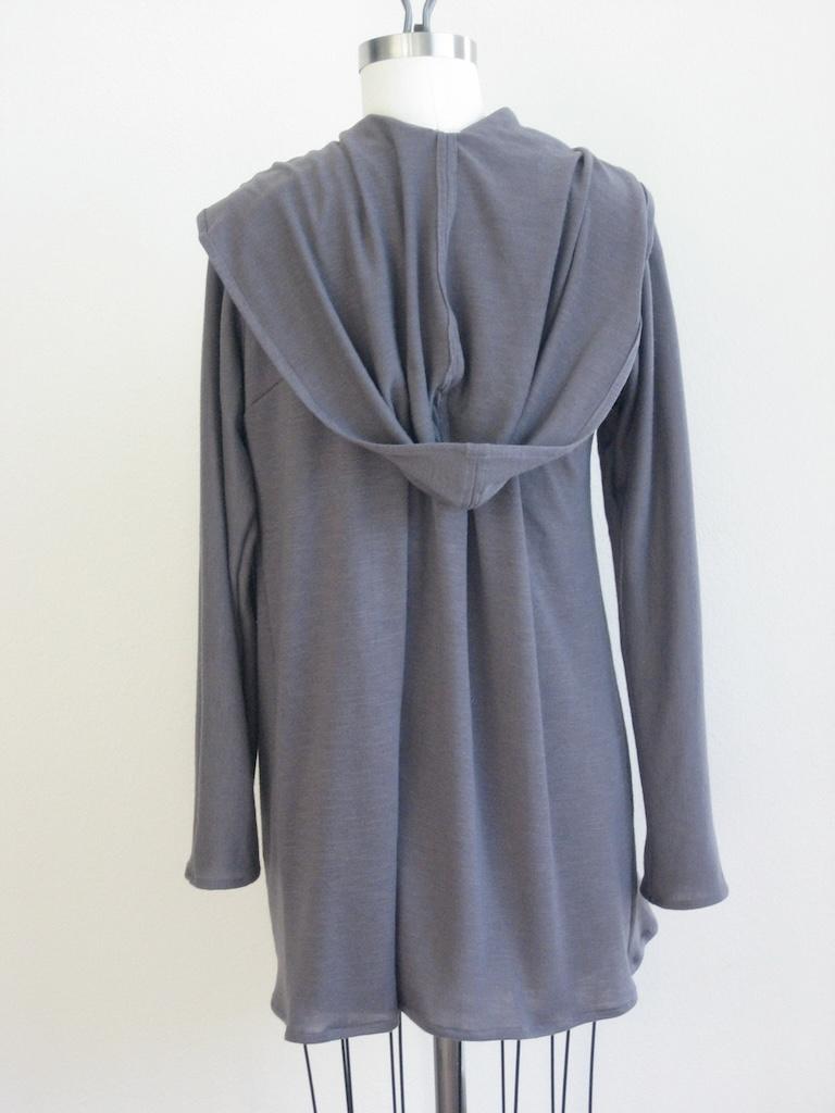 Back view of Luna’s cardigan hoodie made from gray sweater knit fabric on the dress form