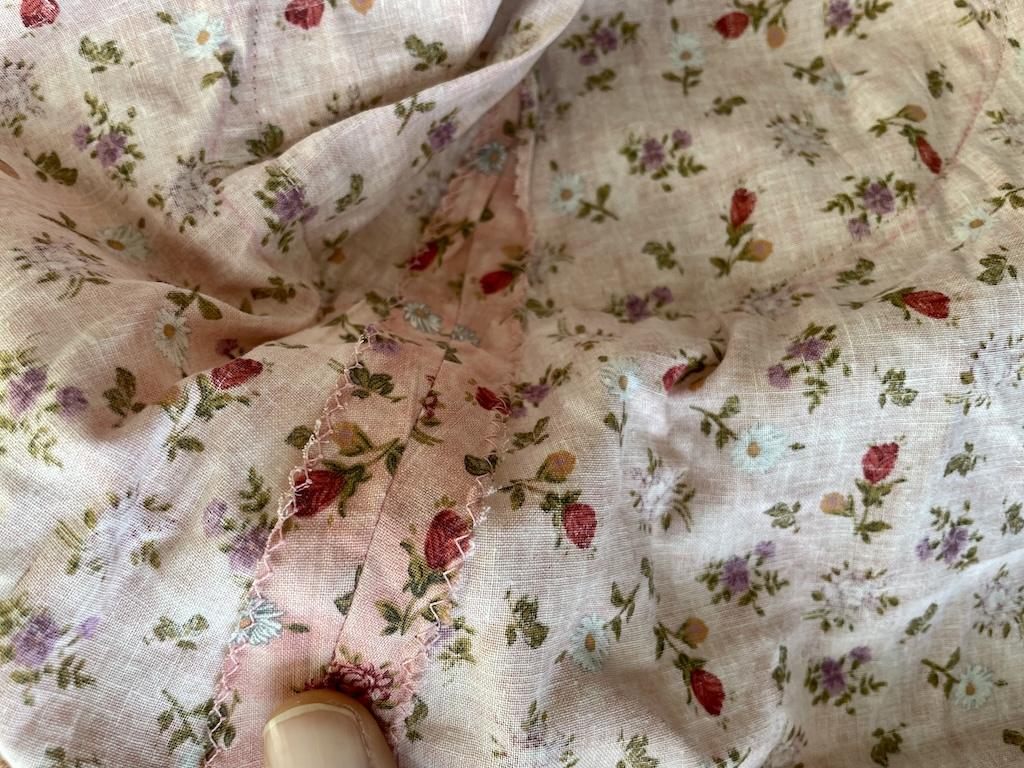 Close up of side seams of Luna’s DIY dress with zig-zag stitches to finish the edges