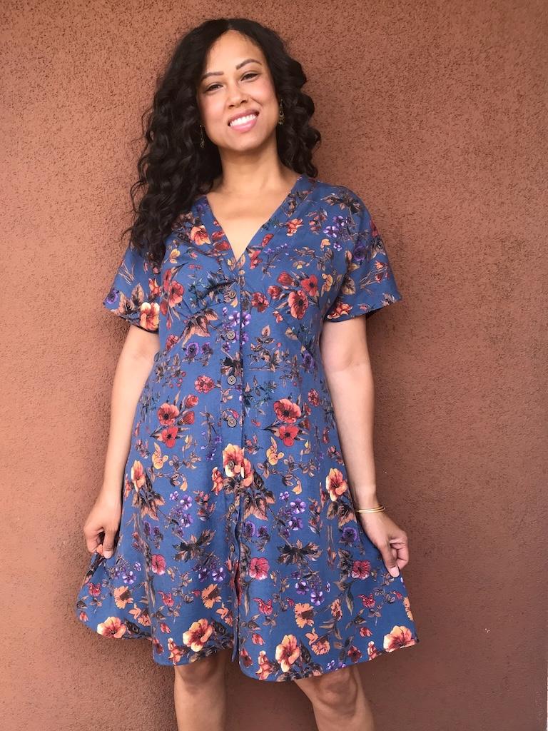 Luna smiling with hands down sides wearing her empire waist dress made with McCall’s M8104 sewing pattern