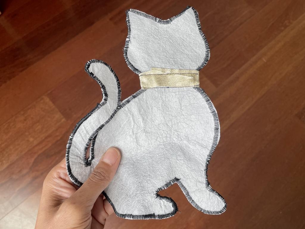 Backside of Luna’s applique of a cat made from McCall’s sewing pattern that she sewed with a zig zag stitch