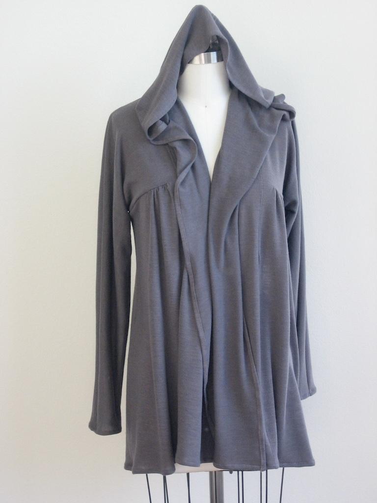 Front view of Luna’s DIY cardigan with hood up on the dress form made of gray sweater knit fabric 