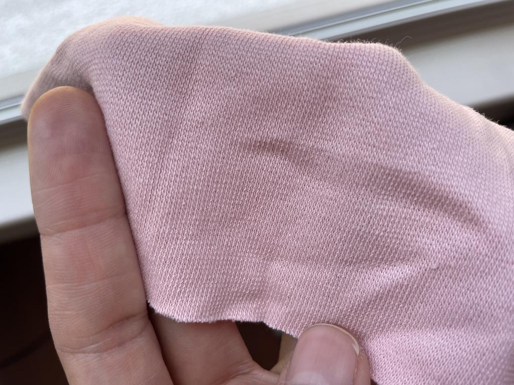Close up of pink sweater knit fabric Luna used to make her top