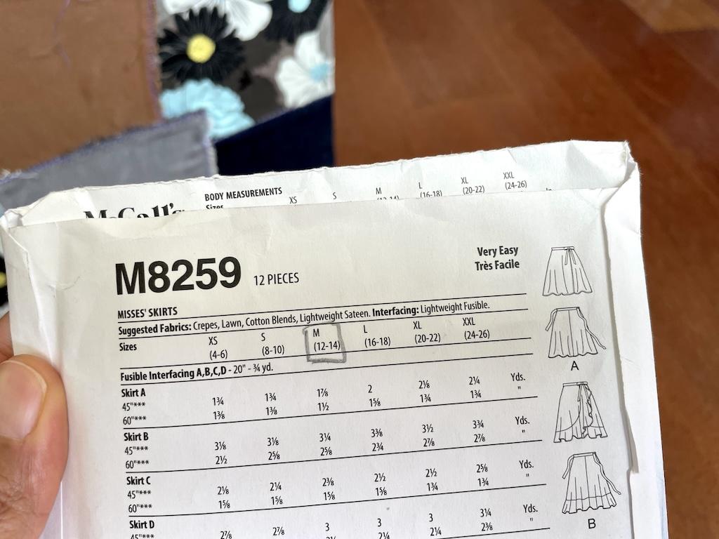 Close up of the back of a McCall’s learn to sew pattern showing the suggested fabrics to make the skirt sewing pattern
