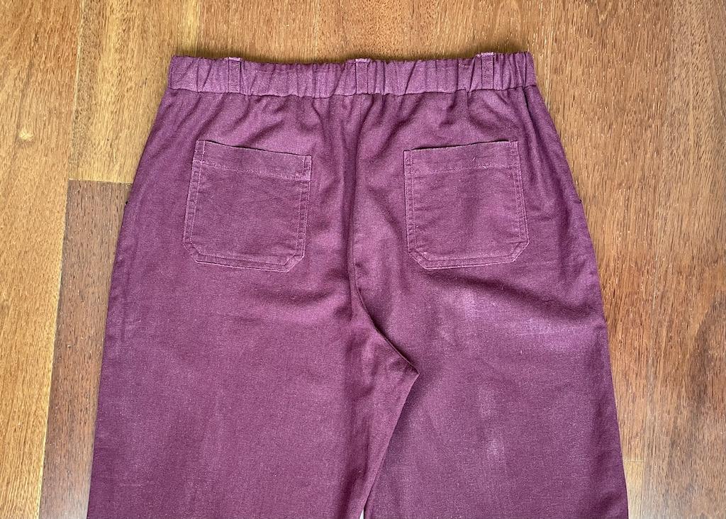 Back view of Luna’s straight leg pants made in linen fabric with pockets