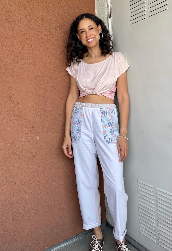 Front view of Luna smiling to the camera wearing her mockup pants made from Simplicity S9050 pattern