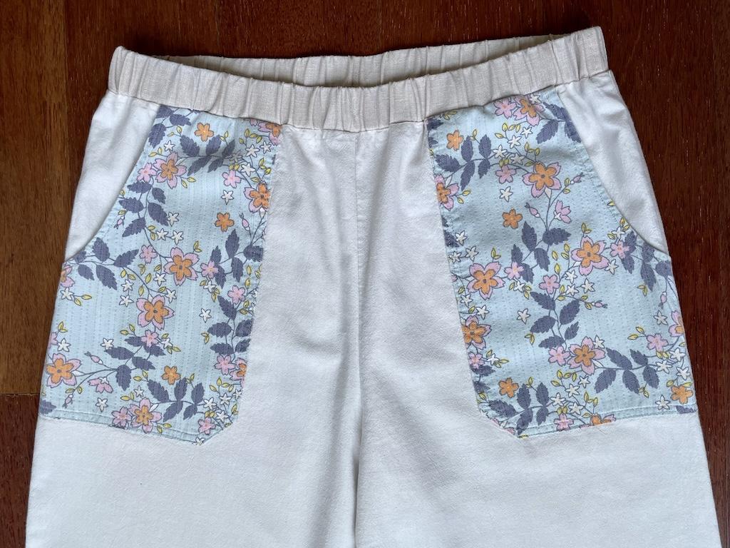 Close up front view of Luna’s pants mockup with elastic waistband and pockets