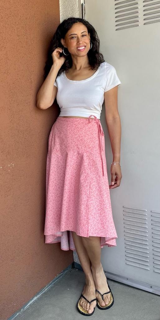 Luna smiling to the camera wearing her DIY tie wrap skirt with high low hem