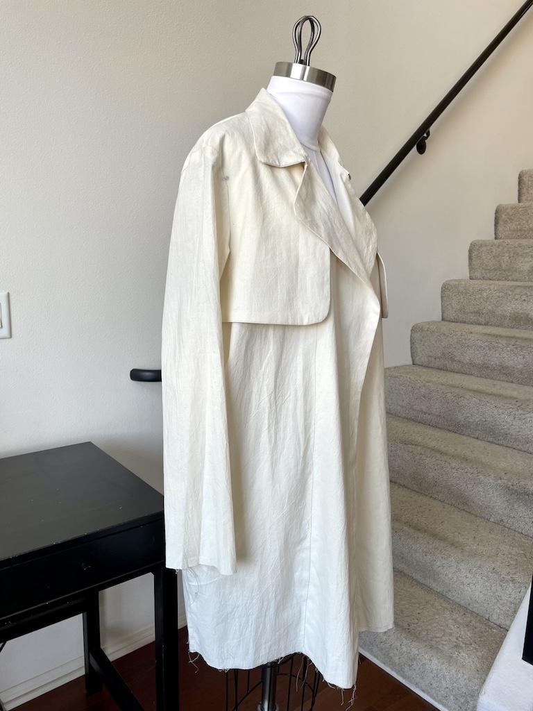 Front angle view of Luna’s mockup trench coat in long length on her dress form