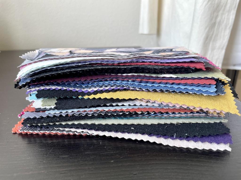 Close up of Luna’s handmade fabric swatches in a stack