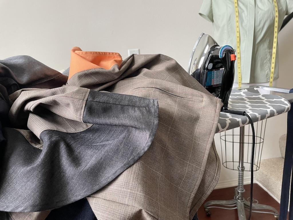 Luna’s DIY clothes on her ironing board in sewing room