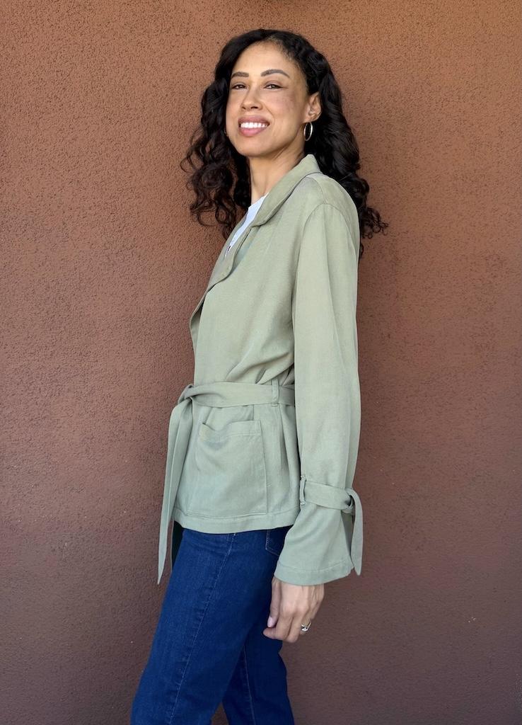 Side view of Luna smiling and wearing her DIY soft trench coat in short length