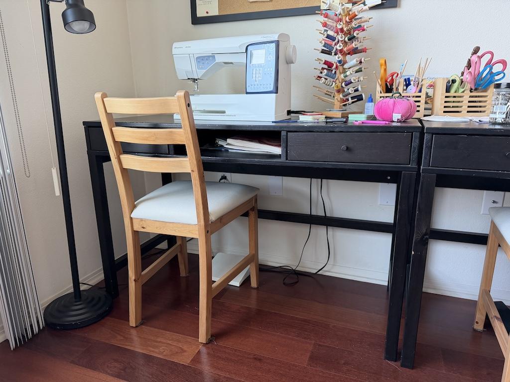 View of IKEA desk with sewing machine that Luna uses