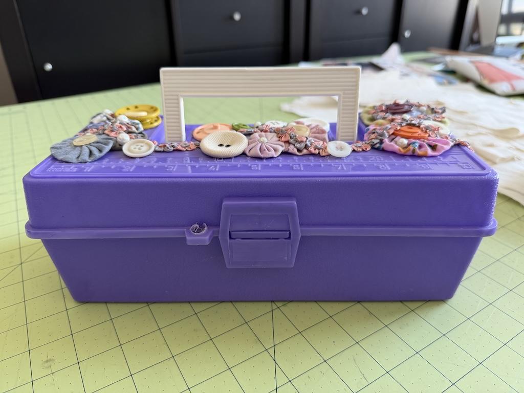 View of small tackle box that Luna decorated in her sewing room