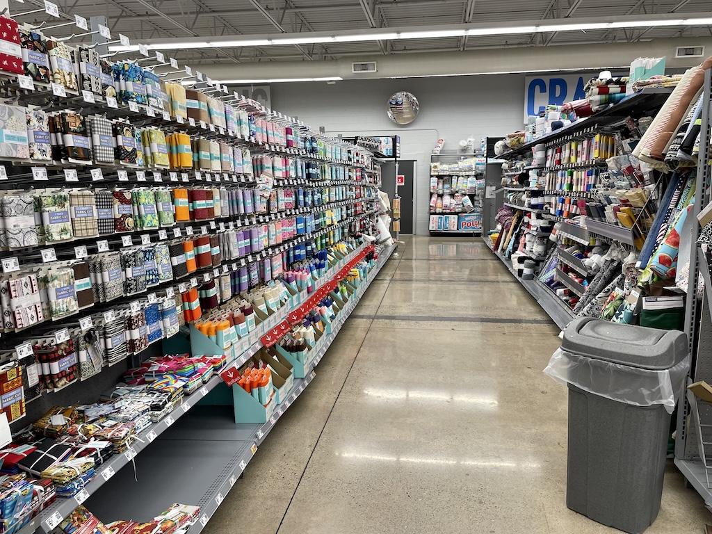 View of pre-cut quilting cotton that Luna saw in the craft department at Walmart