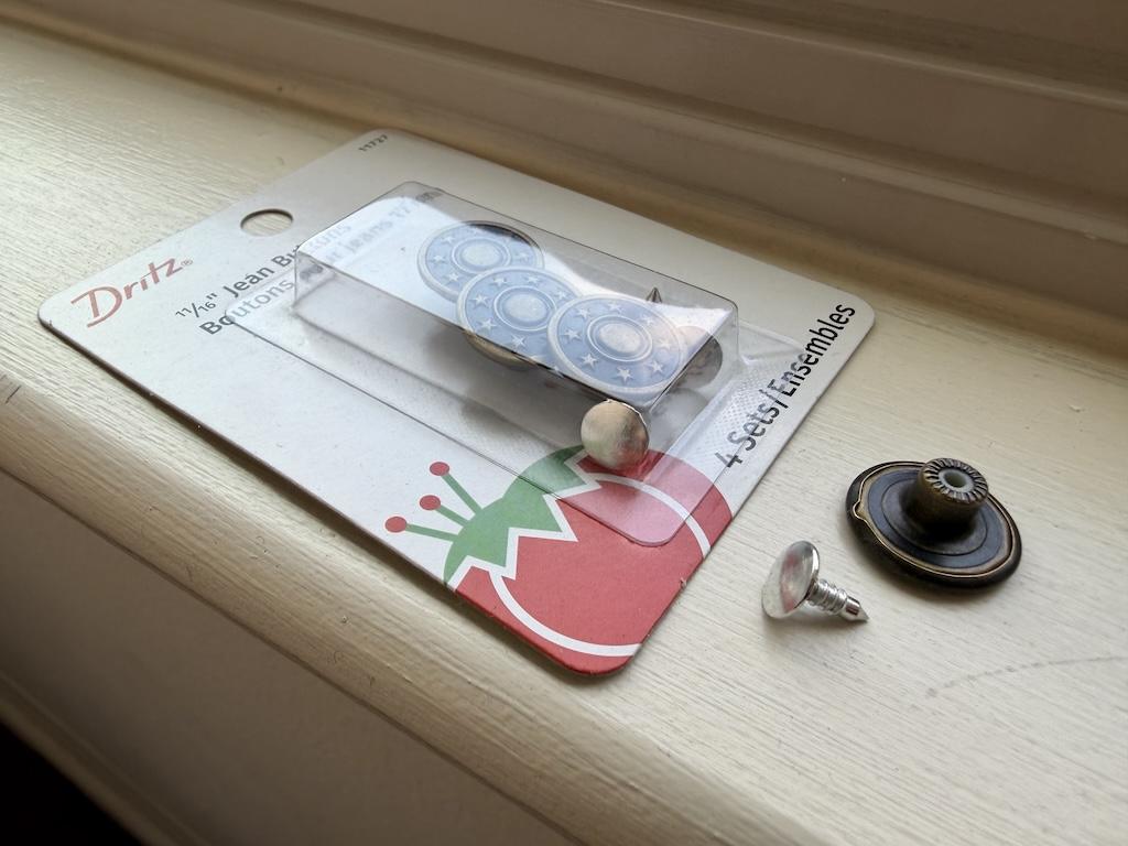 Package of Dritz jeans buttons showing the tack and caps, that Luna uses on the garments she makes
