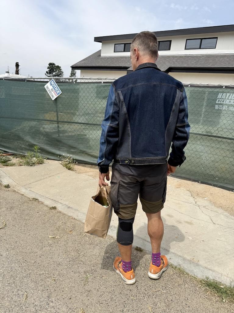 Back of man wearing DIY color blocked denim jacket that Luna made with Simplicity S8845 sewing pattern
