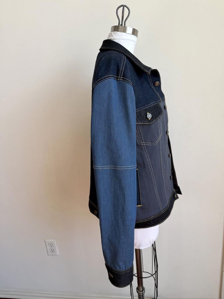 Side view of Luna’s DIY color blocked denim jacket on the dress form, that she made with Simplicity S8845 sewing pattern