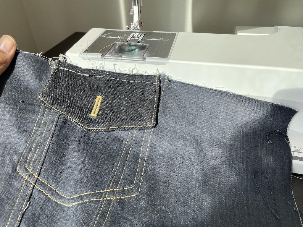 Sewing flap pocket on Luna’s DIY color blocked denim jacket with the sewing machine