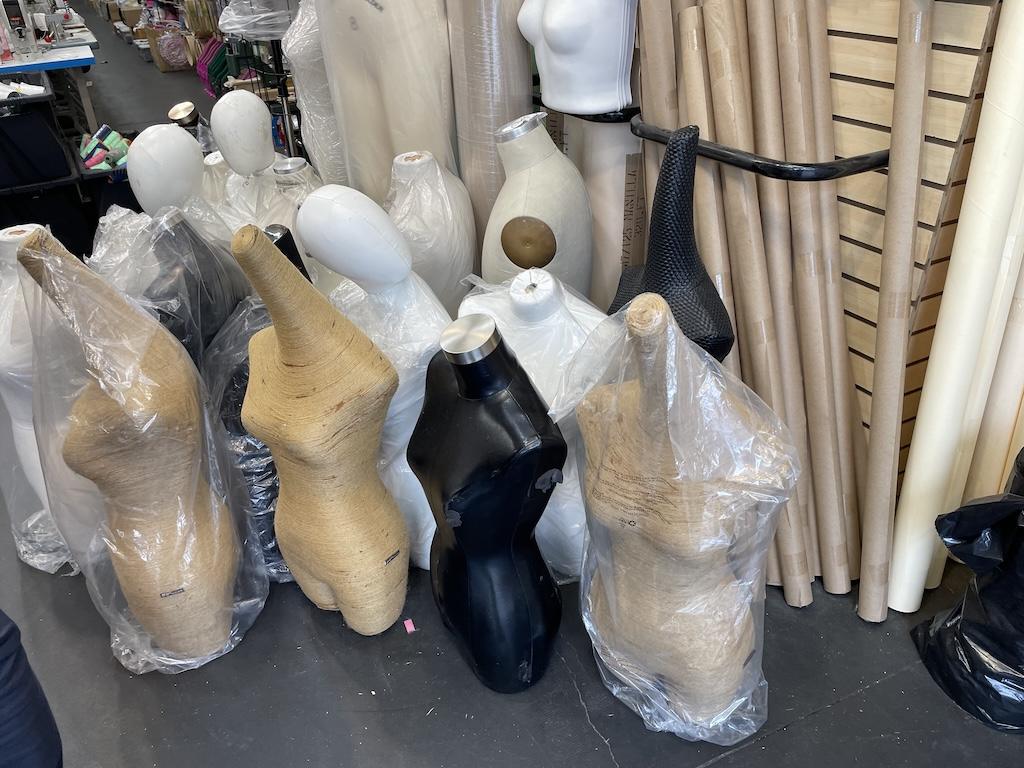 View of different types of dress forms in sewing shop