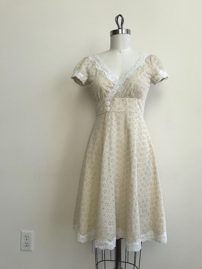 Front view of DIY eyelet dress that Luna made on the dres form