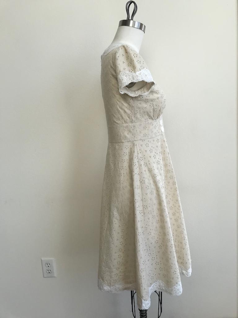 Side view of DIY eyelet dress that Luna made on the dres form