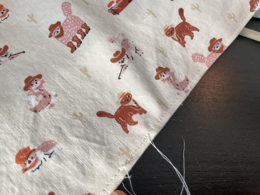 Close up of stitches on DIY reversible fabric napkins