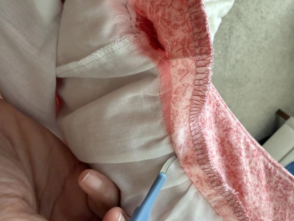 Luna deconstructing the waistband of cotton skirt