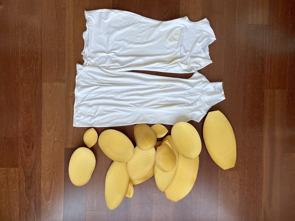 Two bodysuits and padding that come with the Fabulous Fit Fitting System