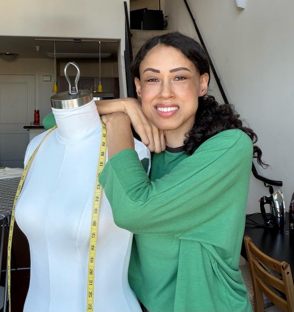 Luna smiling to camera with dress form that she padded using the Fabulous Fit Fitting System