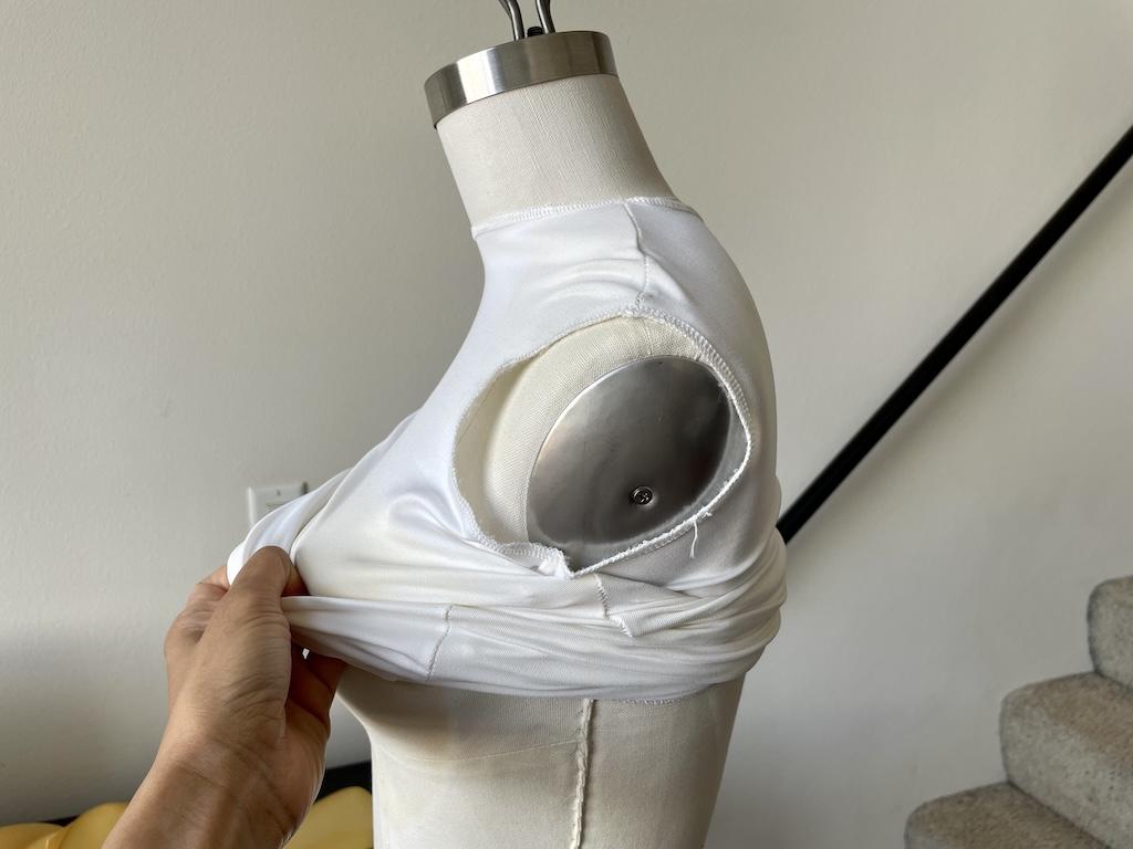 Luna’s hand rolling on first bodysuit on dress form before padding it using the Fabulous Fit System