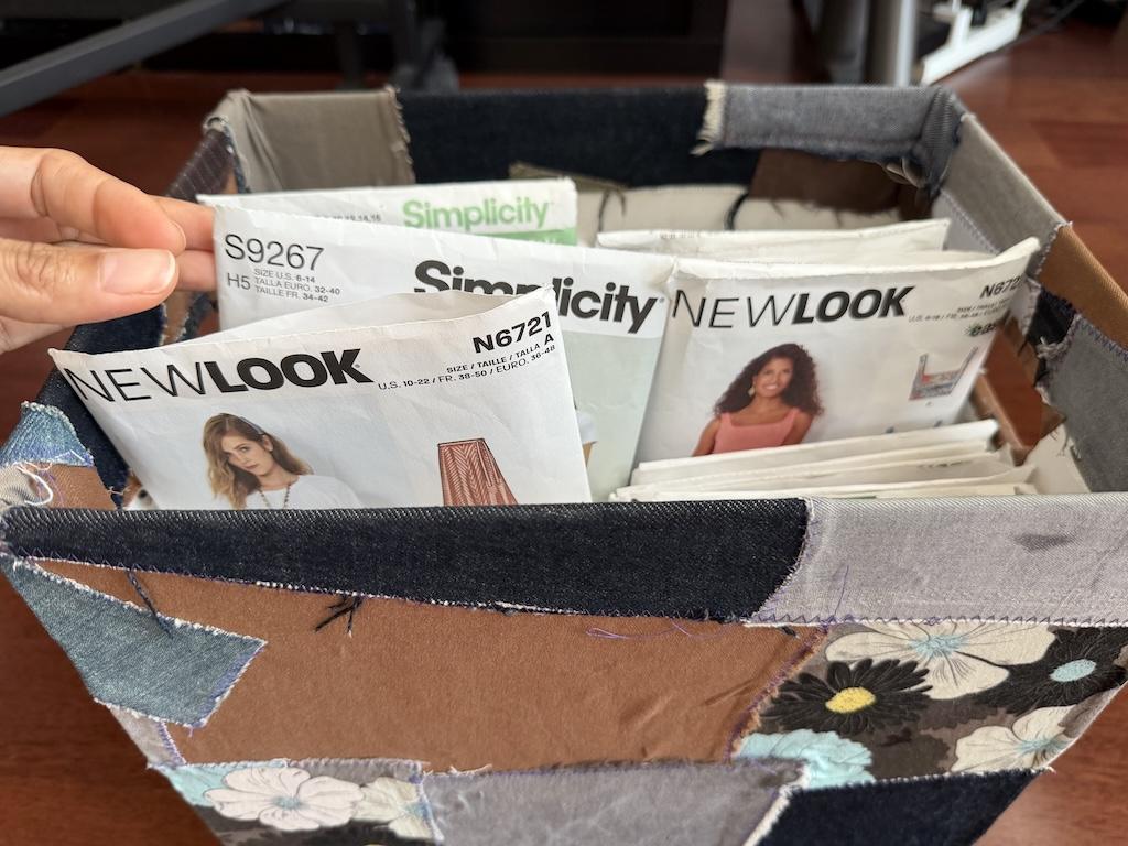 Part of Luna’s sewing pattern collection in a storage box